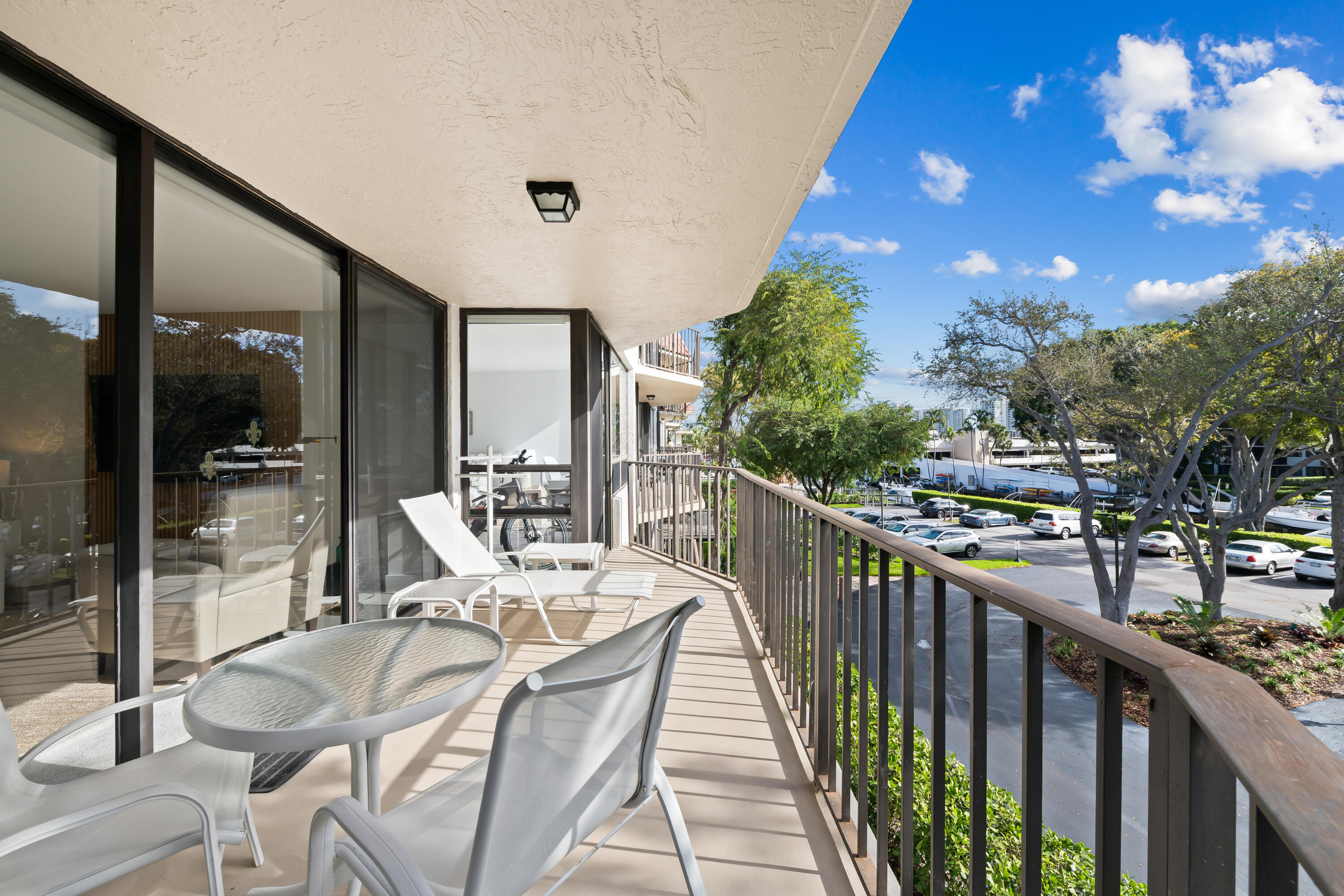 799 Jeffery Street, Unit 303 Boca Raton, FL 33487 - Photo 25 of 42 a view of a balcony with chairs