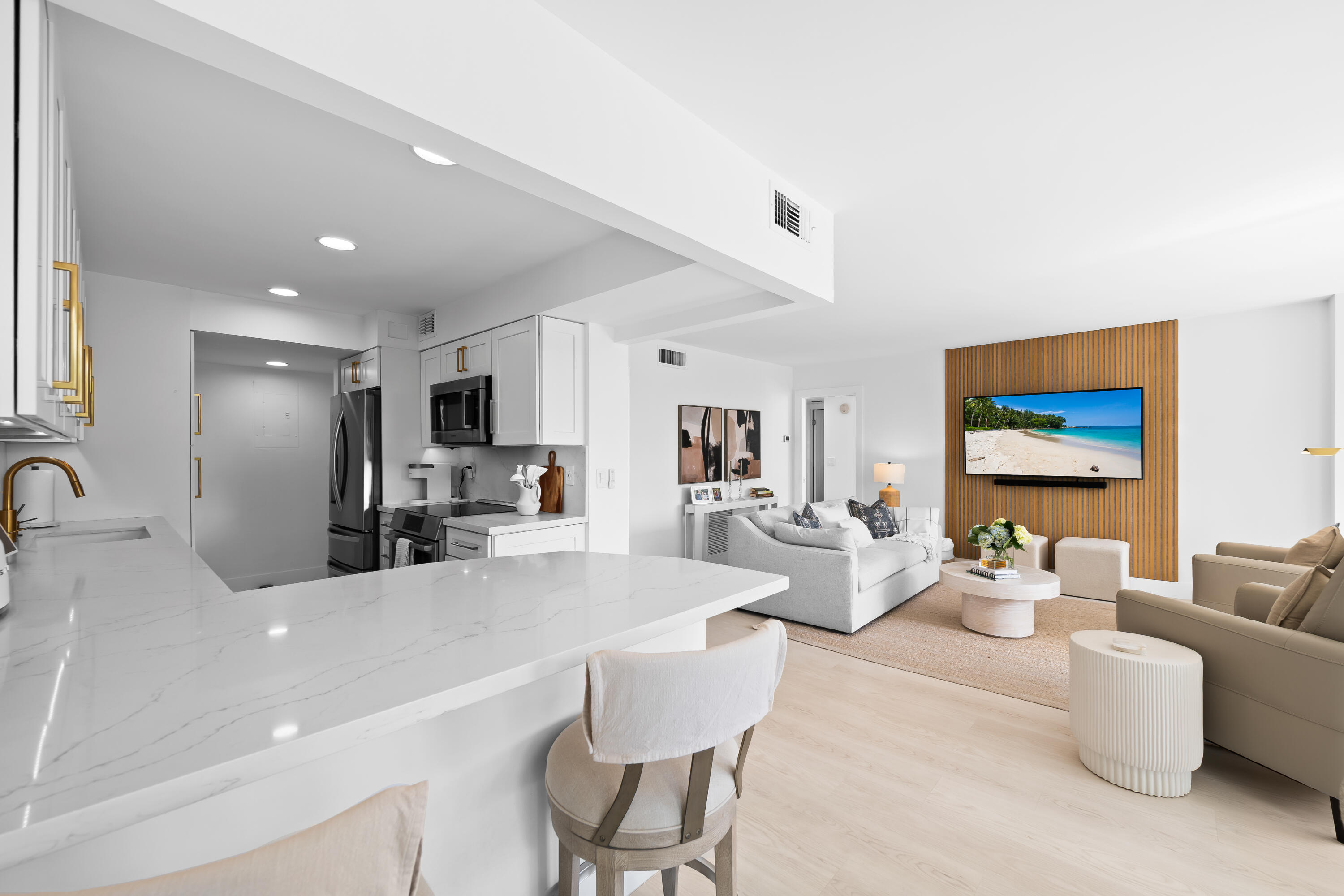 799 Jeffery Street, Unit 303 Boca Raton, FL 33487 - Photo 4 of 42 a kitchen with a sink cabinets and living room view
