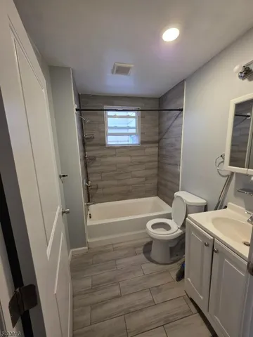 a bathroom with a toilet a sink and a bathtub