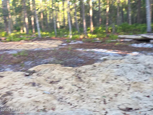 a view of road with brick building