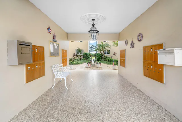 a view of a kitchen with furniture and wooden floor