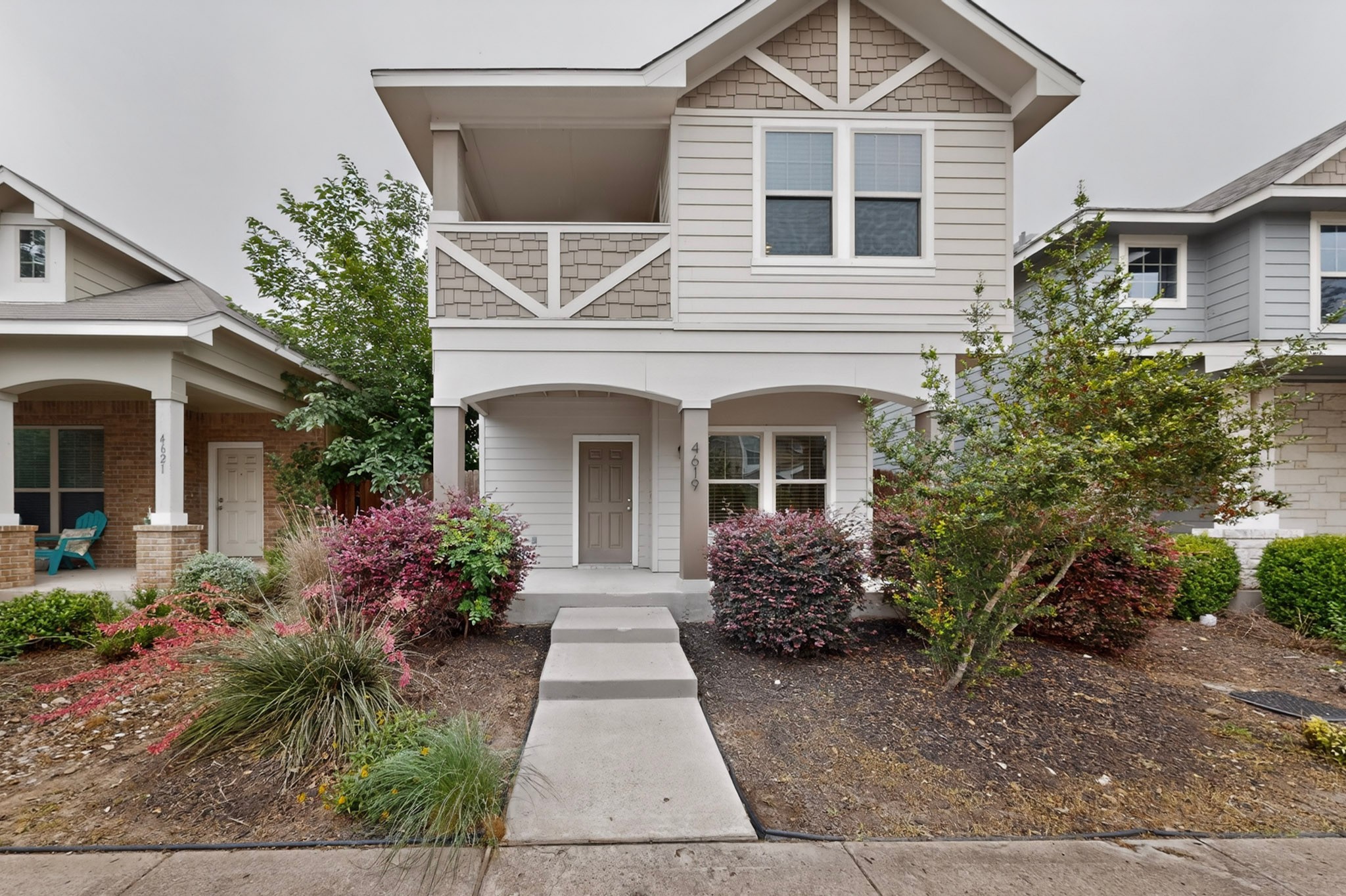 4619 Inicio Lane Austin, TX 78725 - Photo 2 of 32 a front view of a house with garden