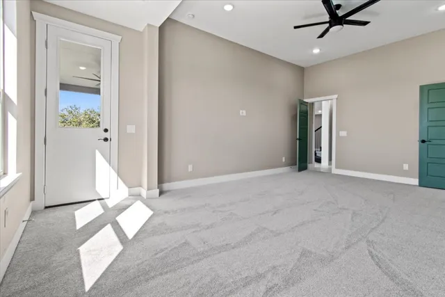 a view of an empty room and a window