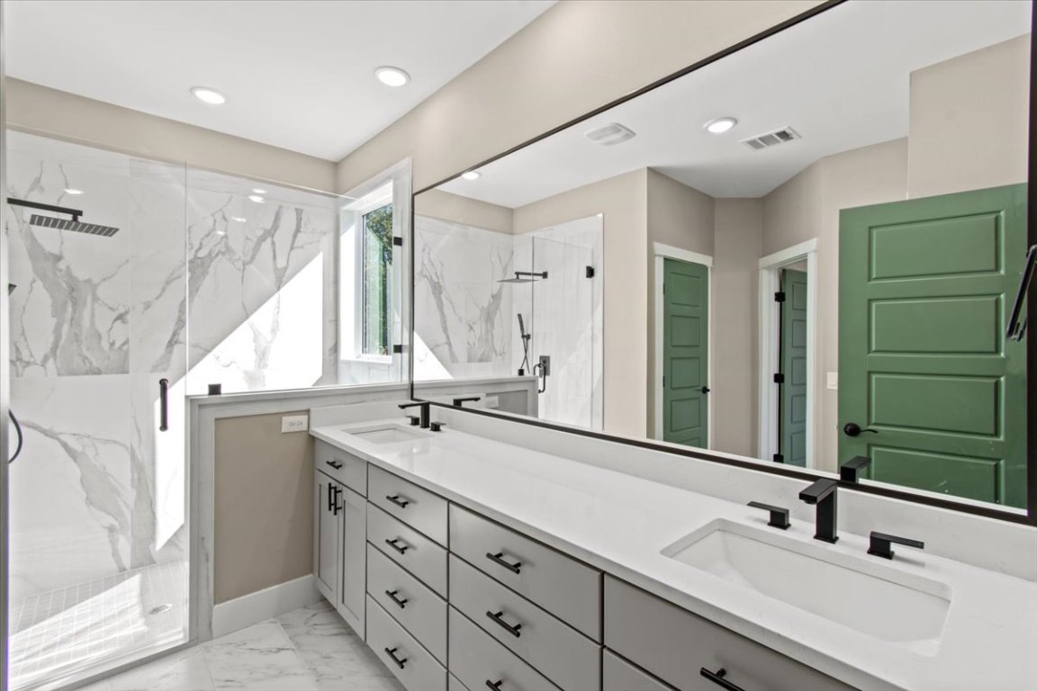 17503 Panorama Drive Dripping Springs, TX 78620 - Photo 12 of 26 a bathroom with a double vanity sink mirror and double