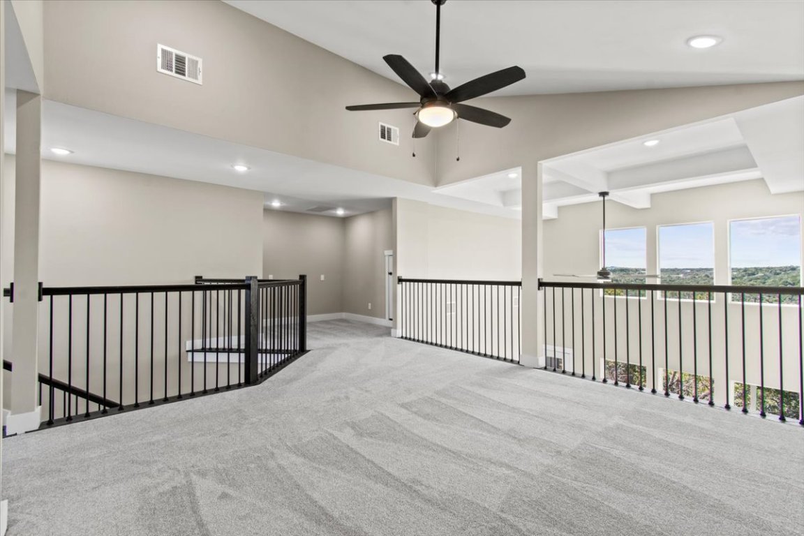 17503 Panorama Drive Dripping Springs, TX 78620 - Photo 16 of 26 a view of a hallway with a ceiling fan