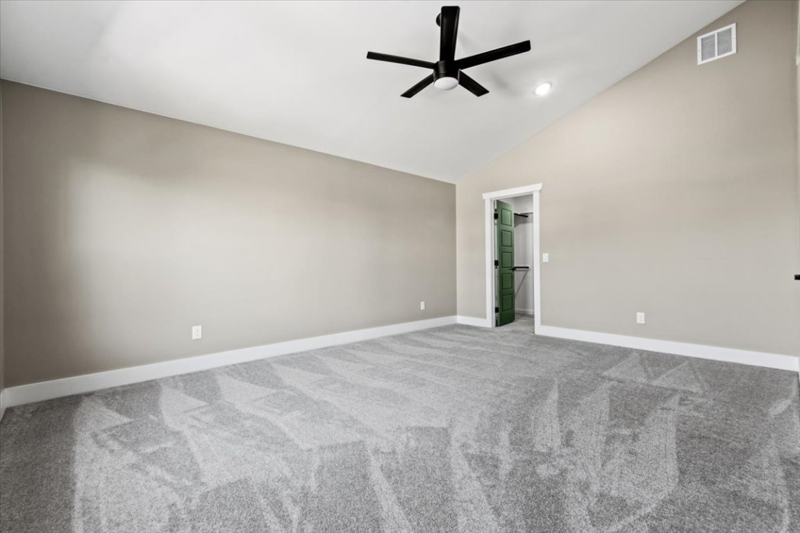 17503 Panorama Drive Dripping Springs, TX 78620 - Photo 19 of 26 an empty room with ceiling fan and window