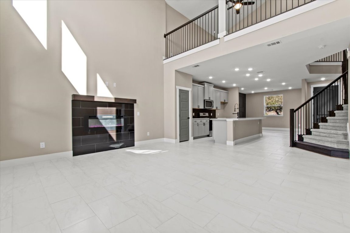 17503 Panorama Drive Dripping Springs, TX 78620 - Photo 8 of 26 a view of a hall with kitchen and a window
