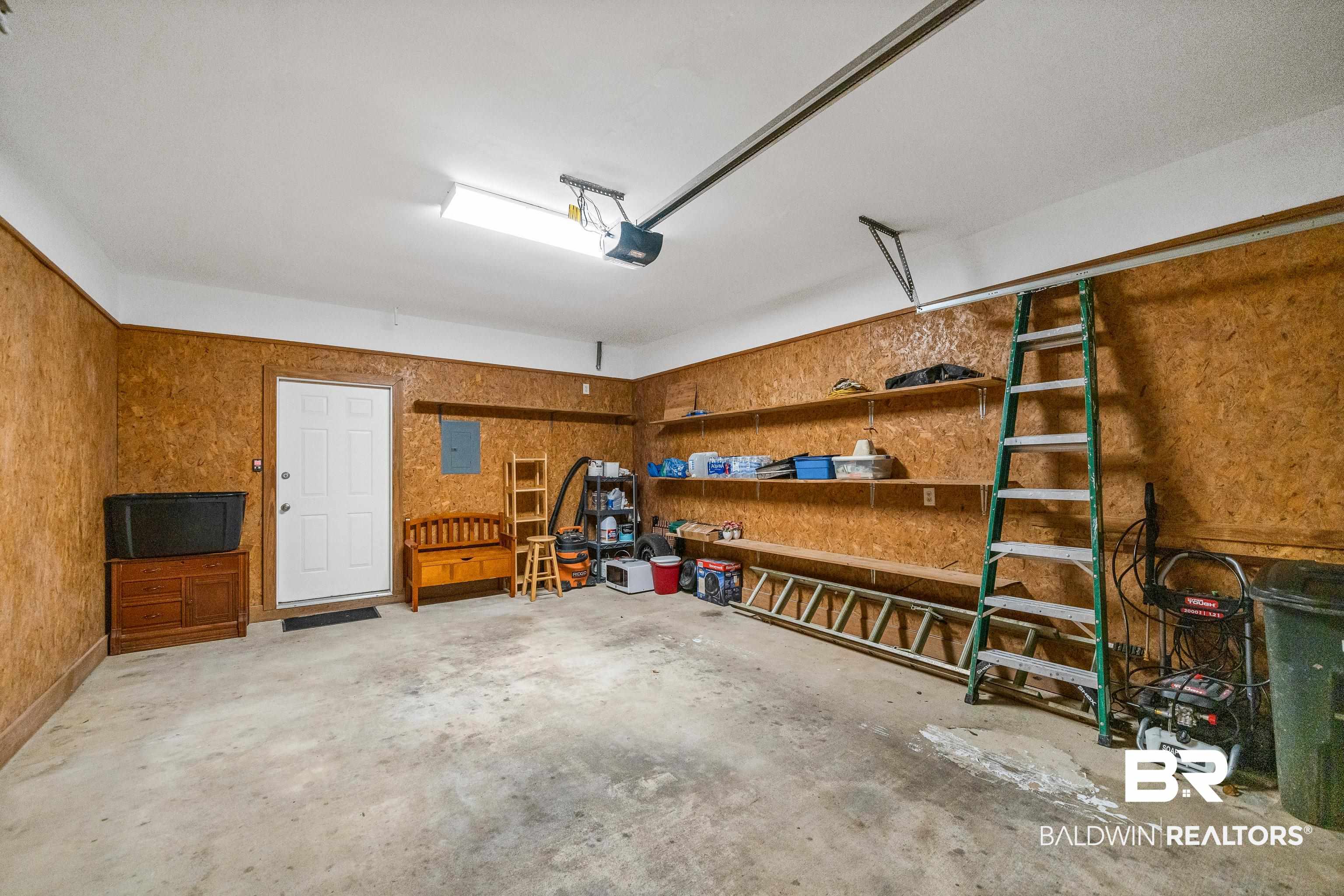 27 Cottage Drive Fairhope, AL 36532 - Photo 28 of 33 Garage featuring electric panel