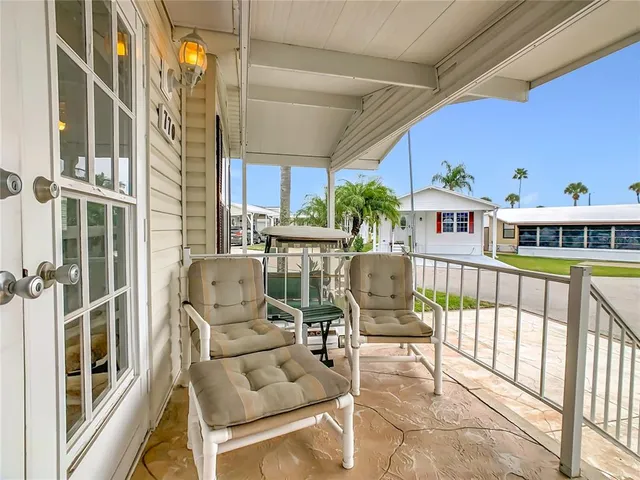 a view of a balcony with furniture
