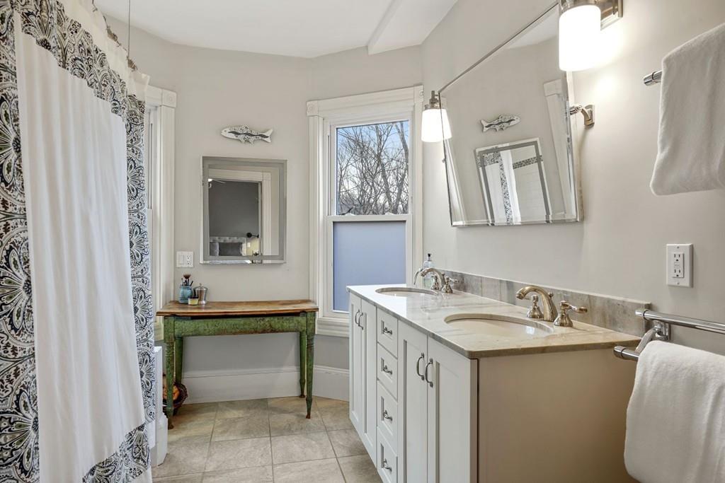 87 Hillside Road Newton, MA 02461 - Photo 13 of 30 a bathroom with a sink and a mirror