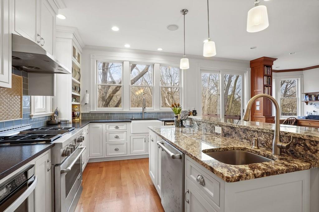 87 Hillside Road Newton, MA 02461 - Photo 2 of 30 a kitchen with a sink stove and cabinets