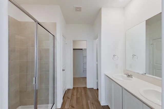 a bathroom with a sink and mirror