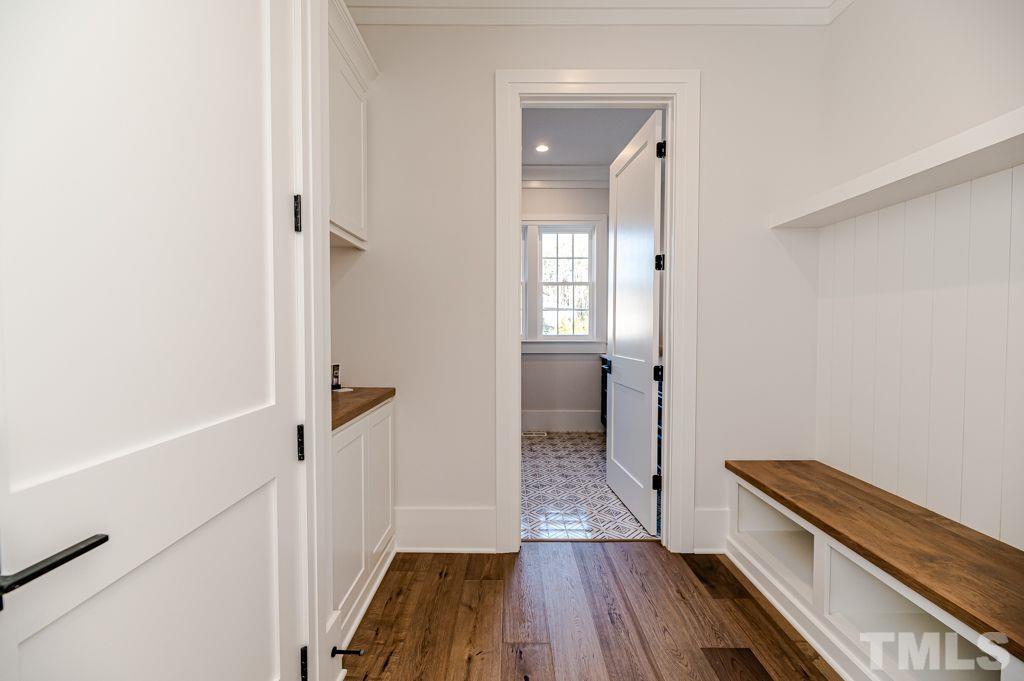 1501 Kirkby Lane Raleigh, NC 27614 - Photo 22 of 54 a view of a room with wooden floor and staircase