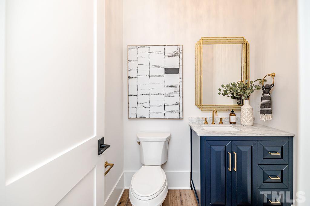 1501 Kirkby Lane Raleigh, NC 27614 - Photo 26 of 54 a bathroom with a granite countertop toilet sink and mirror