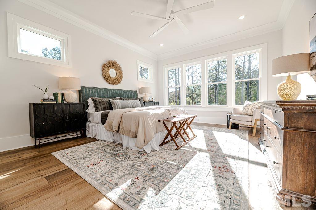 1501 Kirkby Lane Raleigh, NC 27614 - Photo 28 of 54 a living room with furniture a rug and a large window