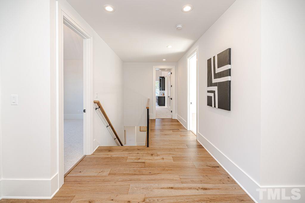 1501 Kirkby Lane Raleigh, NC 27614 - Photo 34 of 54 a view of a hallway with wooden floor and staircase