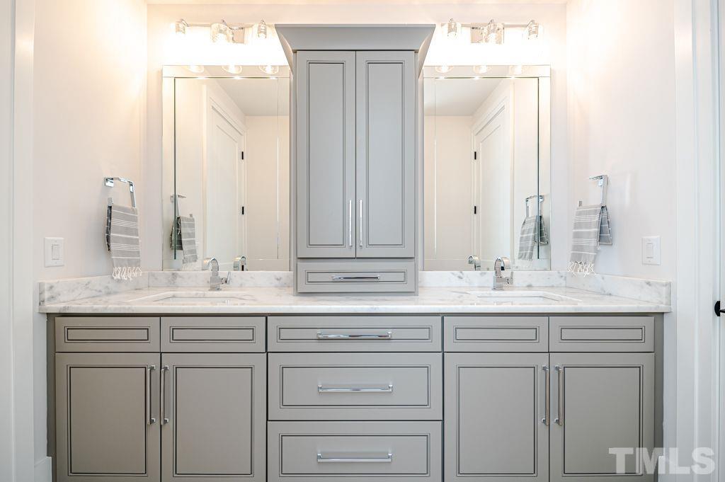 1501 Kirkby Lane Raleigh, NC 27614 - Photo 38 of 54 a bathroom with a sink and a mirror