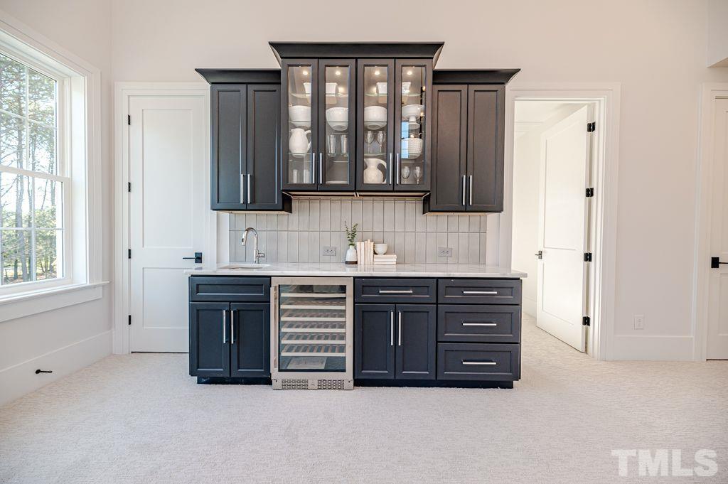 1501 Kirkby Lane Raleigh, NC 27614 - Photo 42 of 54 a bathroom with a granite countertop sink a mirror and a bathtub