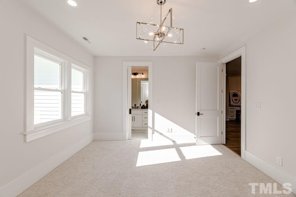 1501 Kirkby Lane Raleigh, NC 27614 - Photo 44 of 54 a very nice looking room with a large window and chandelier