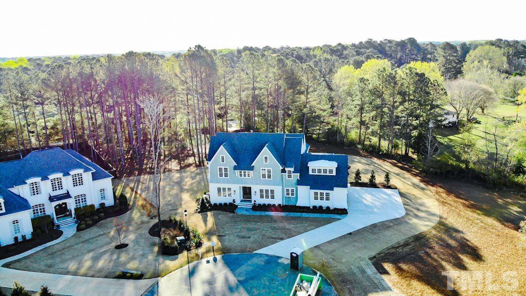 1501 Kirkby Lane Raleigh, NC 27614 - Photo 53 of 54 a view of house with yard swimming pool and outdoor seating