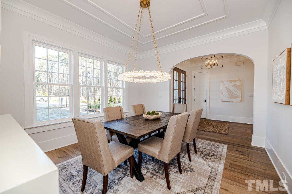 1501 Kirkby Lane Raleigh, NC 27614 - Photo 6 of 54 a view of a dining room with furniture window and wooden floor