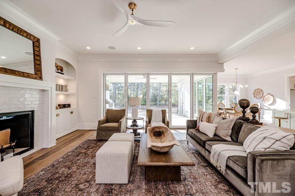1501 Kirkby Lane Raleigh, NC 27614 - Photo 9 of 54 a living room with furniture fireplace and a large window