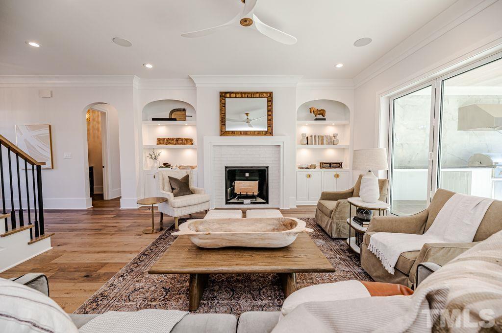 1501 Kirkby Lane Raleigh, NC 27614 - Photo 10 of 54 a living room with furniture fireplace and a large window