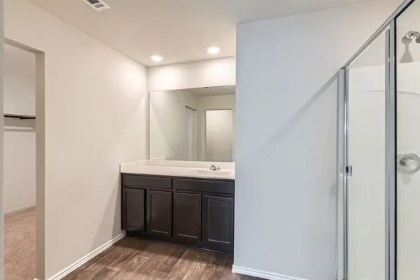 a bathroom with a sink and mirror