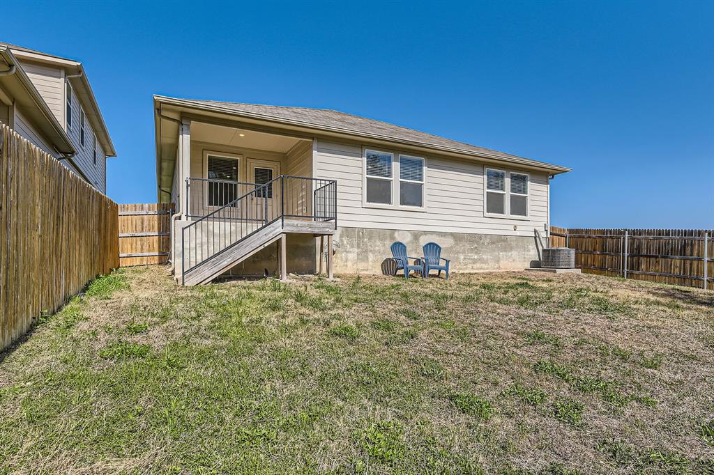 6417 Wideleaf Drive Austin, TX 78724 - Photo 23 of 27 a house view with a backyard space