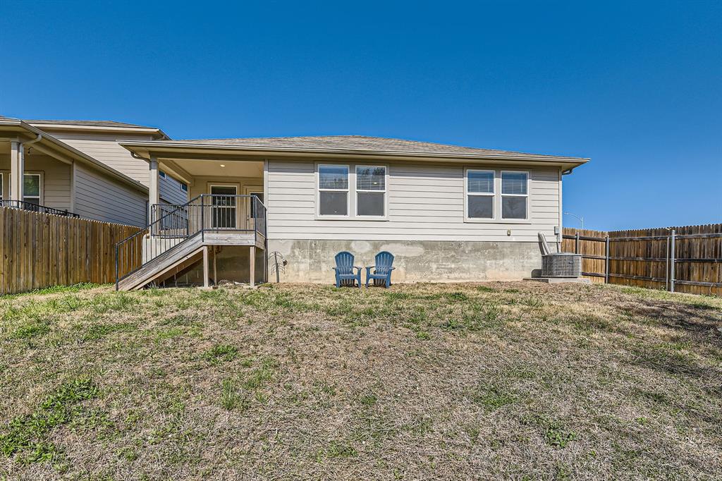 6417 Wideleaf Drive Austin, TX 78724 - Photo 24 of 27 a house view with a backyard space