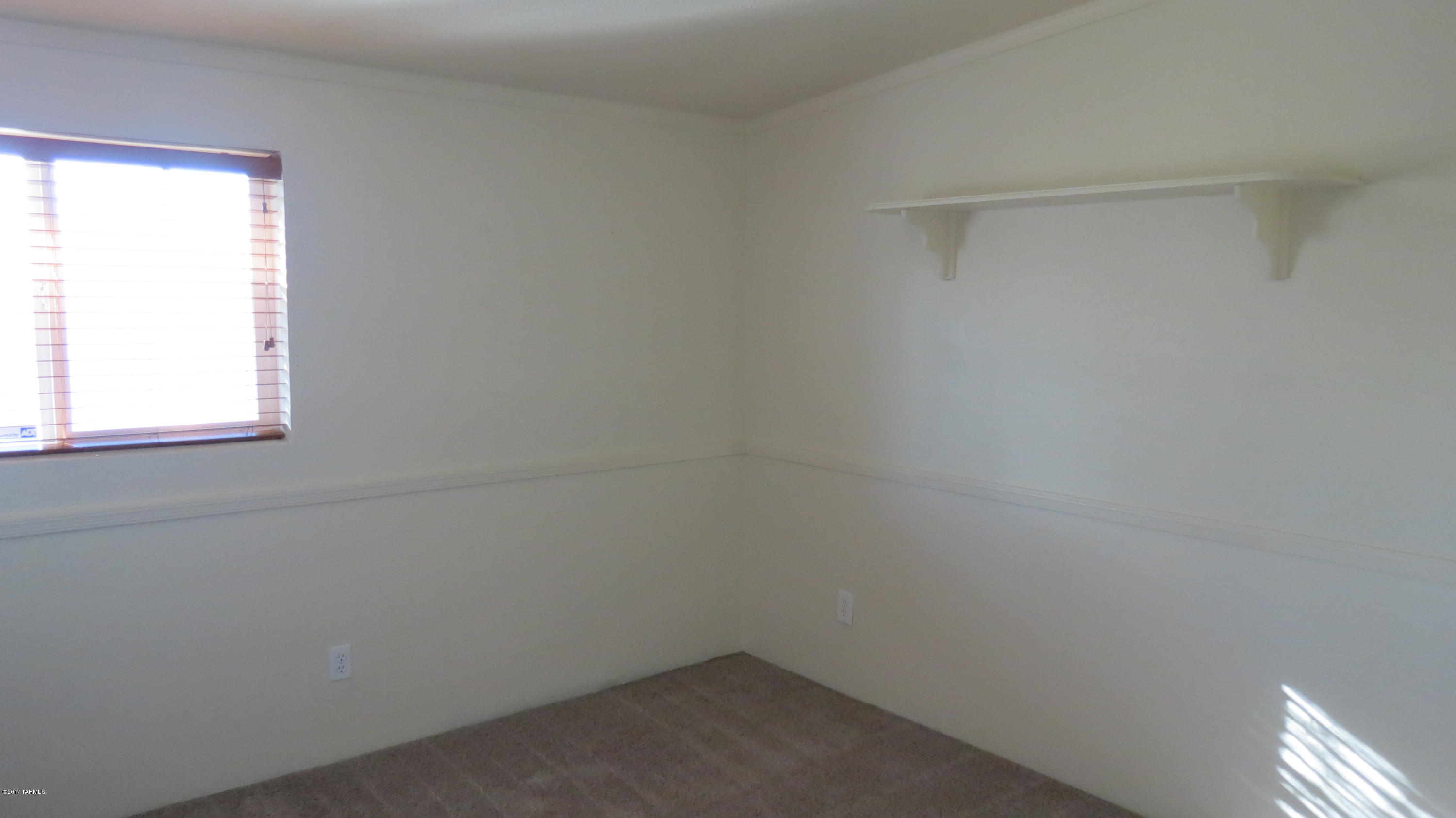 6601 North Mona Lisa Road Tucson, AZ 85741 - Photo 11 of 23 a small space with a window