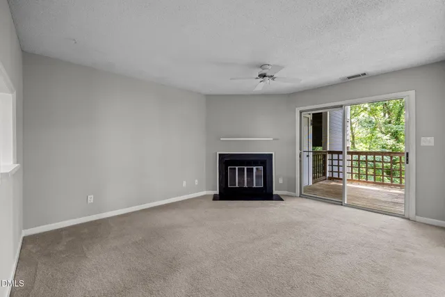 an empty room with windows and entrance