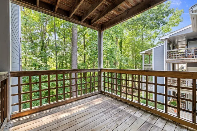 a view of porch with wooden floor