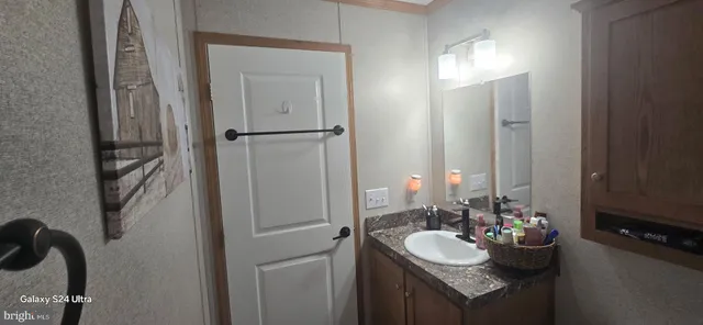 a bathroom with a sink and a mirror
