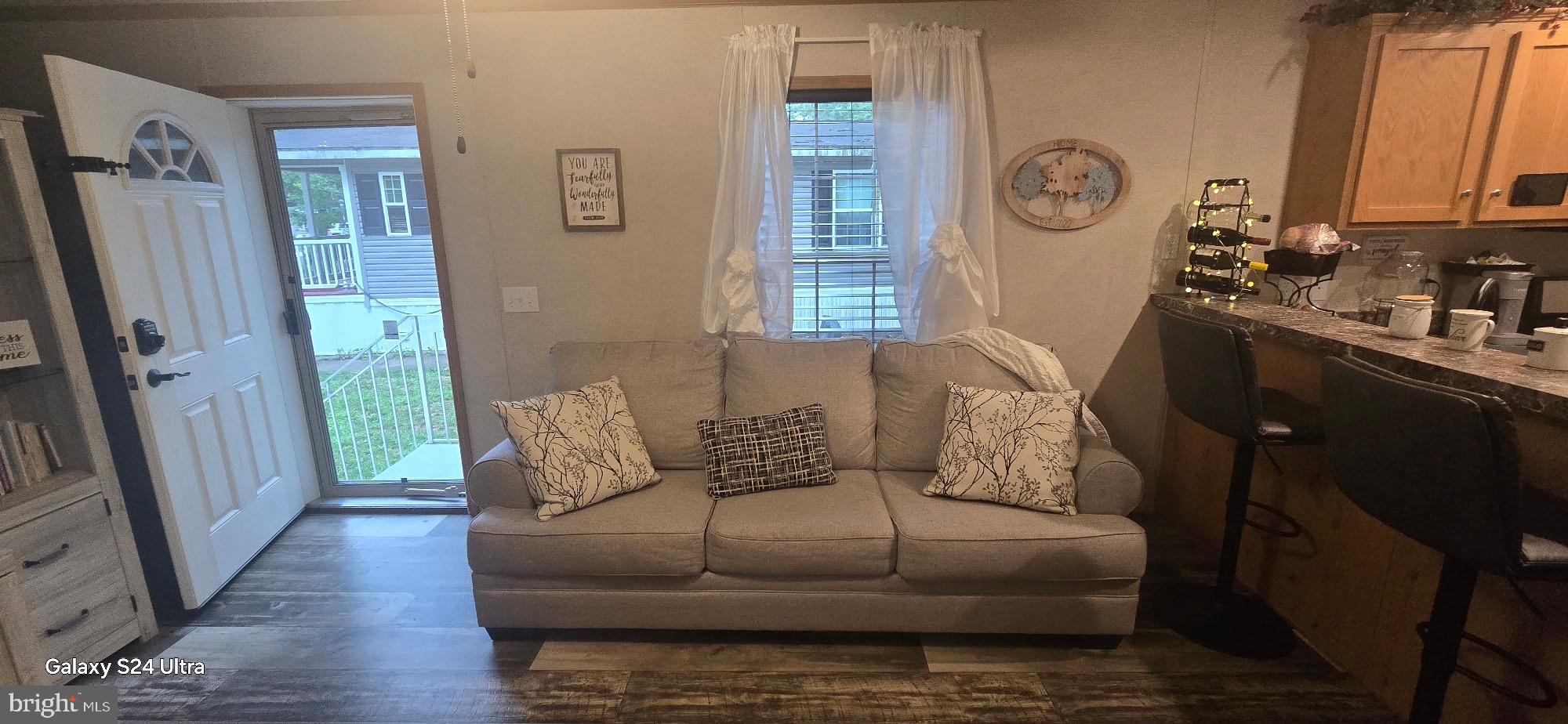 2110 Mays Landing Road, Unit 73 Millville, NJ 08332 - Photo 3 of 11 a living room with furniture and a window