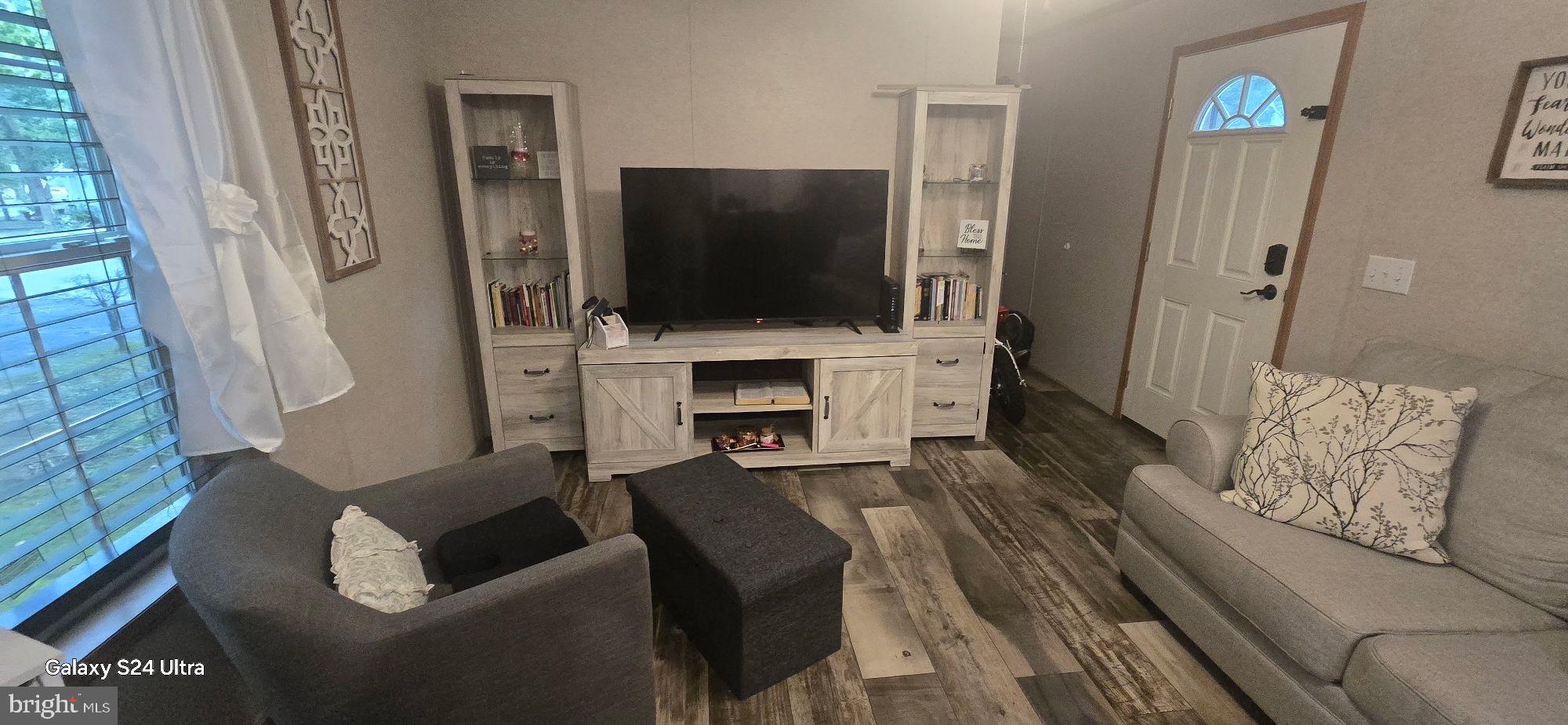 2110 Mays Landing Road, Unit 73 Millville, NJ 08332 - Photo 4 of 11 a living room with furniture and a flat screen tv