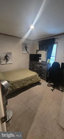 a bedroom with a bed and cabinets