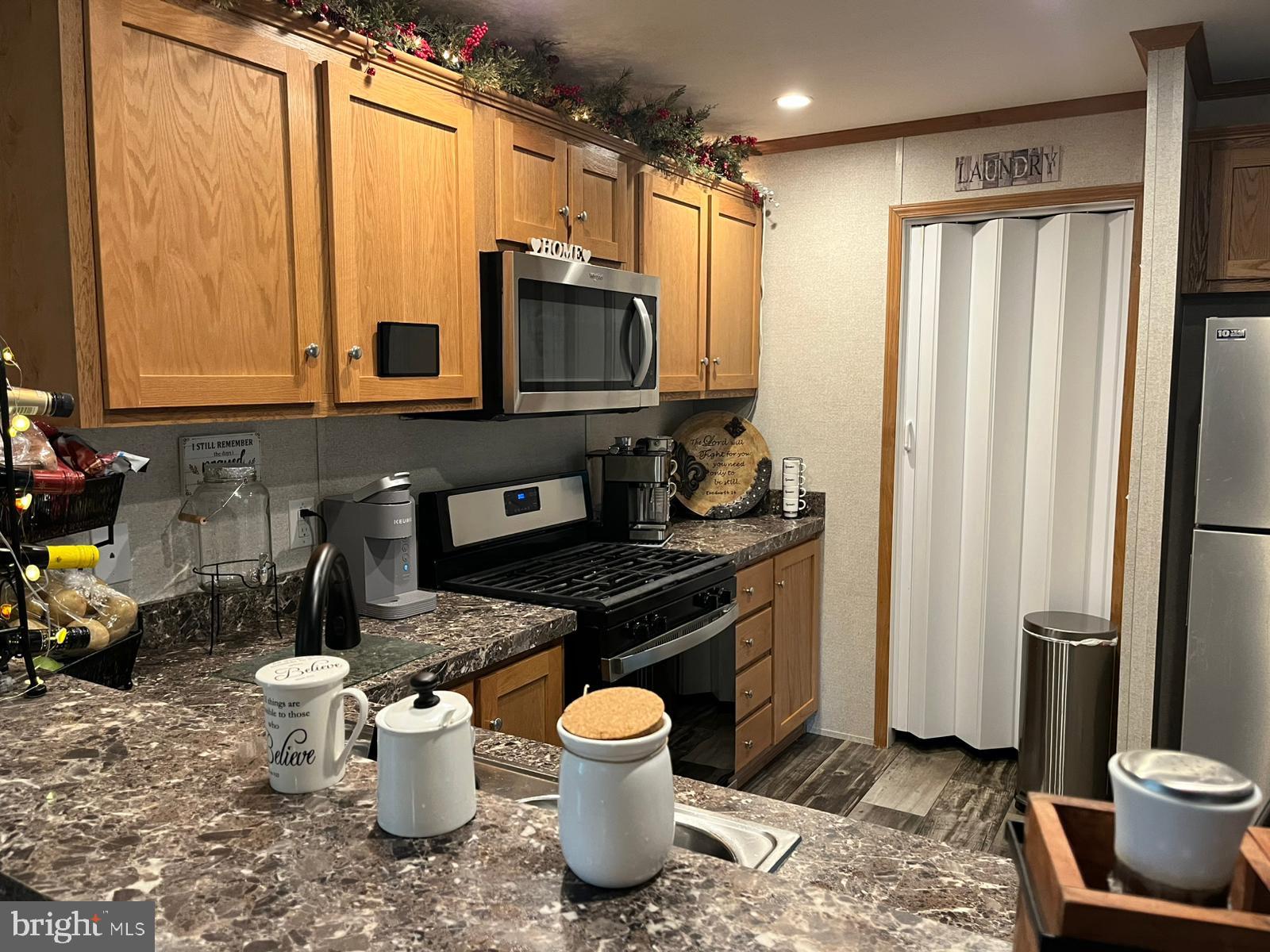 2110 Mays Landing Road, Unit 73 Millville, NJ 08332 - Photo 8 of 11 a kitchen with a sink and a stove top oven