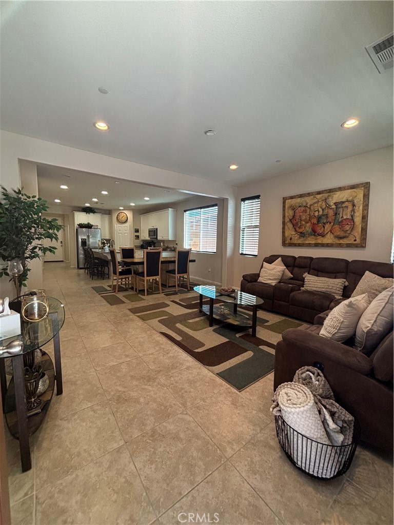 2534 Mapleleaf Terrace Palmdale, CA 93551 - Photo 14 of 48 a living room with furniture kitchen view and a window