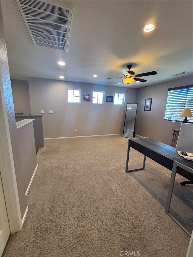 2534 Mapleleaf Terrace Palmdale, CA 93551 - Photo 21 of 48 a view of a room with gym equipment