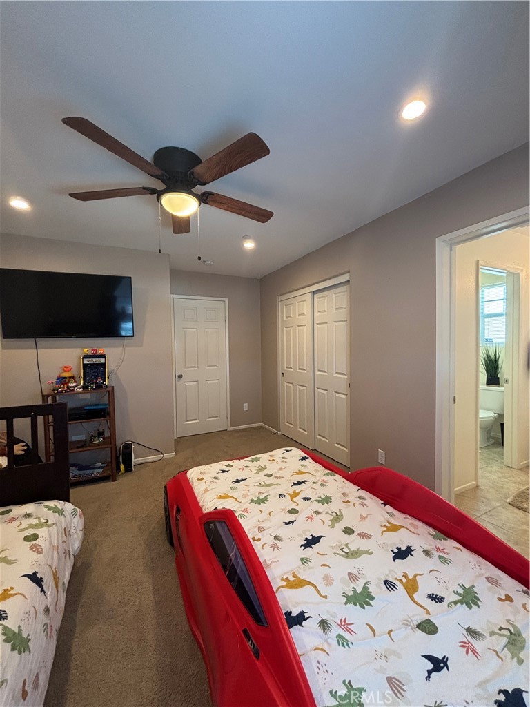 2534 Mapleleaf Terrace Palmdale, CA 93551 - Photo 31 of 48 a bedroom with a bed and a flat screen tv