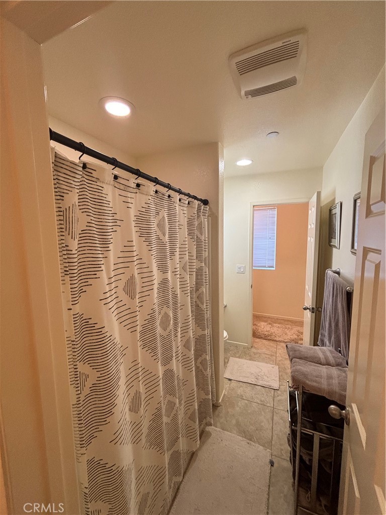 2534 Mapleleaf Terrace Palmdale, CA 93551 - Photo 34 of 48 a bathroom with a shower and a sink