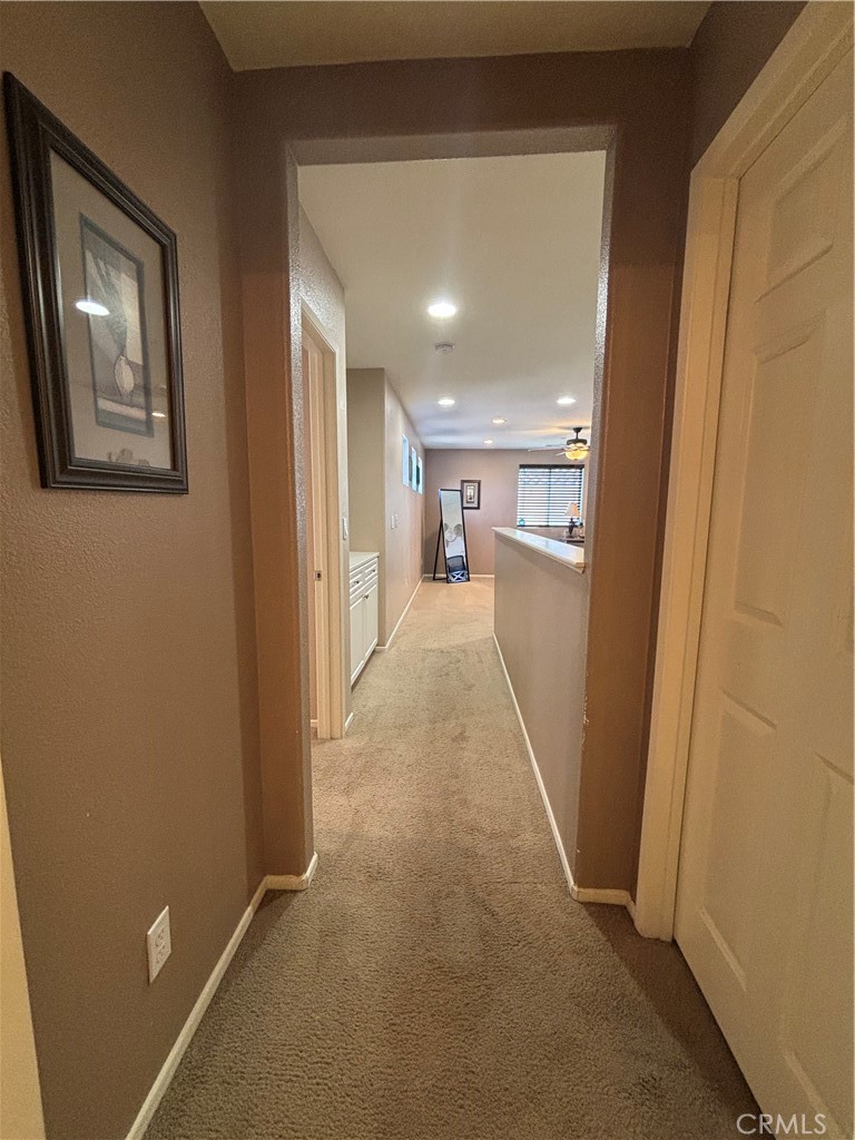 2534 Mapleleaf Terrace Palmdale, CA 93551 - Photo 39 of 48 a view of a hallway with wooden floor