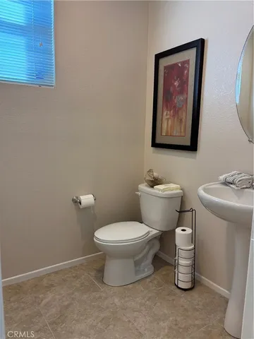 a bathroom with a toilet a sink and a shower