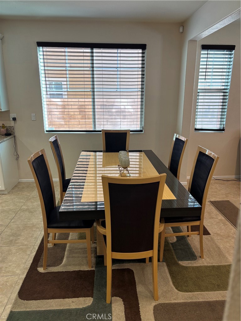 2534 Mapleleaf Terrace Palmdale, CA 93551 - Photo 10 of 48 a view of a workspace with furniture and a window