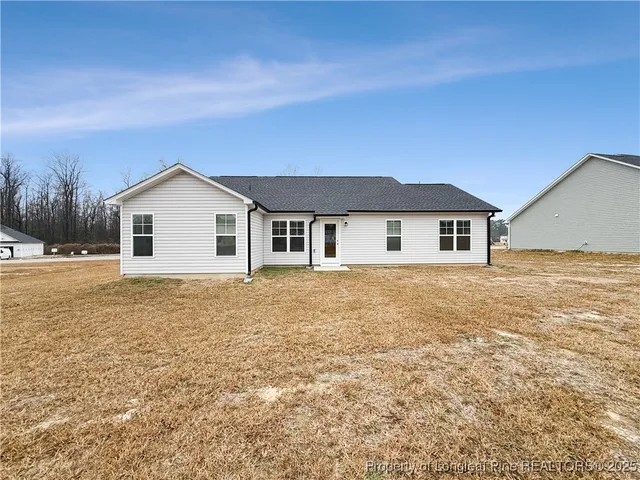a house with yard in front of it