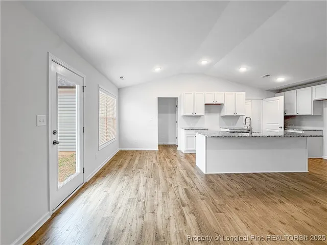 a view of kitchen with wooden floor