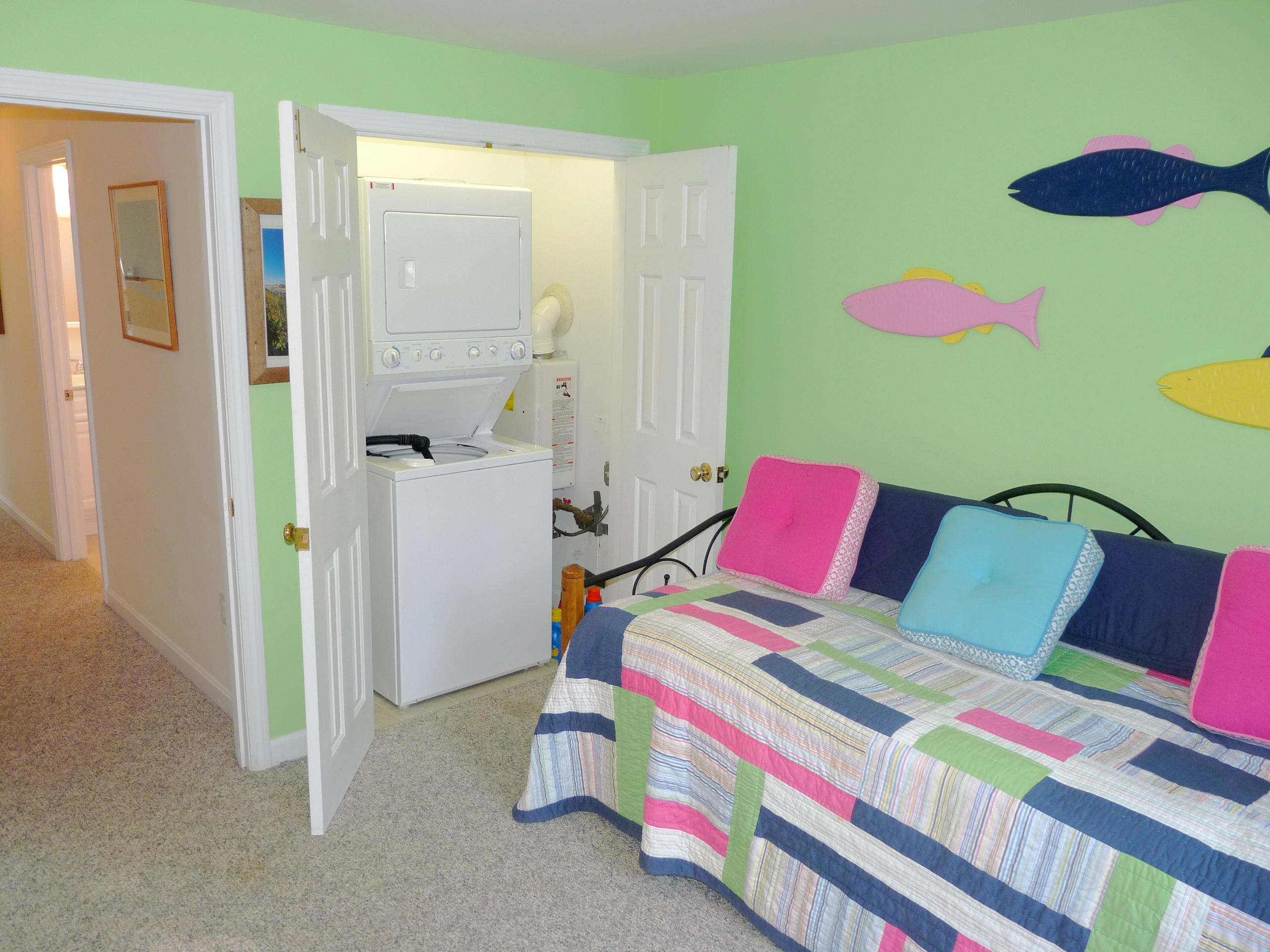 170 Beach Road, Unit 10 Orleans, MA 02653 - Photo 13 of 23 a bedroom with a bed and a dresser