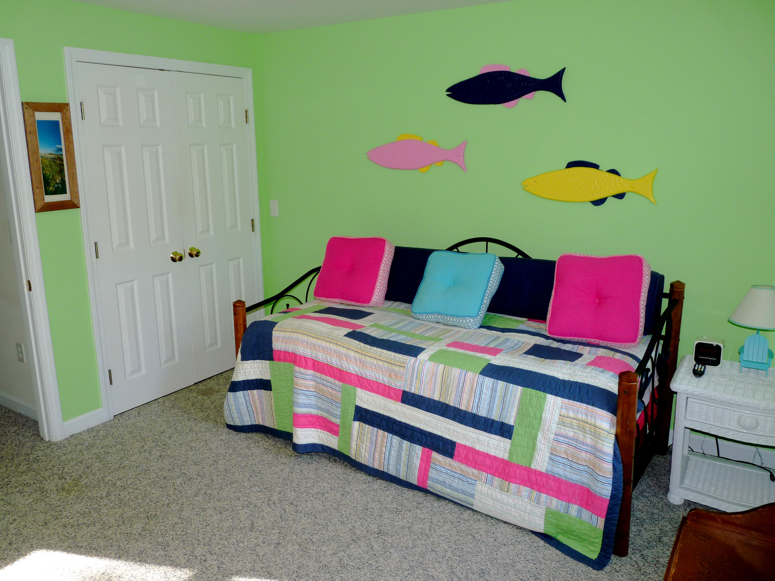 170 Beach Road, Unit 10 Orleans, MA 02653 - Photo 14 of 23 a bedroom with a bed and a painting on the wall