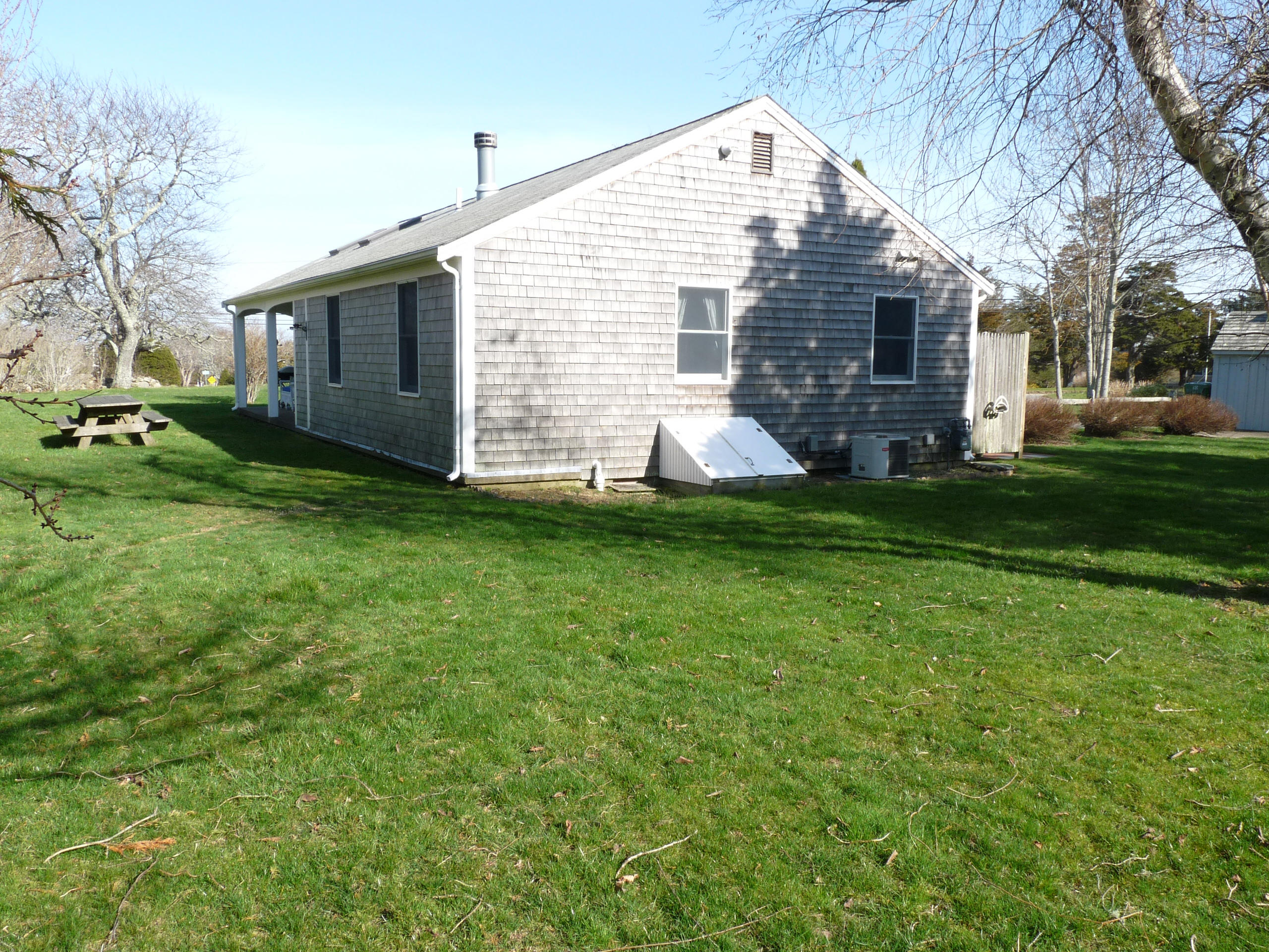 170 Beach Road, Unit 10 Orleans, MA 02653 - Photo 22 of 23 a view of a house with a backyard